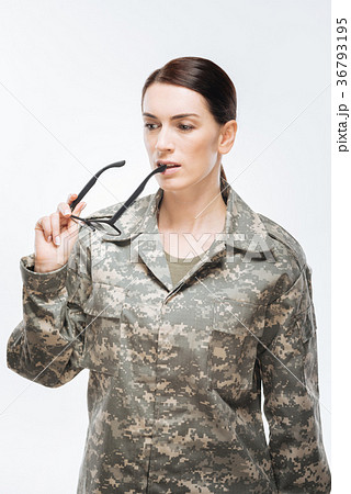 Thoughtful attractive woman securing homeland 36793195