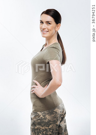 Brunette female soldier posing in camouflage Brunette female soldier posing in camouflage 36794251