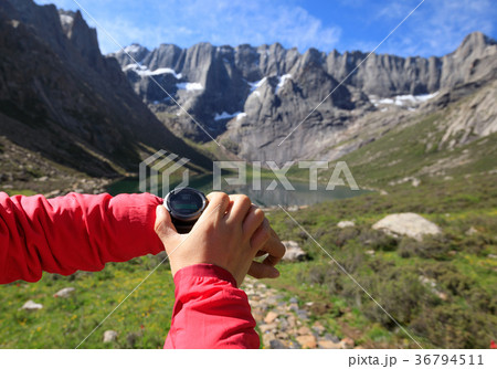 checking altitude with sports watch in mountains checking altitude with sports watch in mountains 36794511