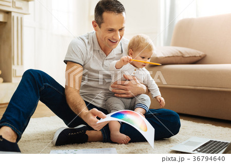 Creative young father entertaining his child and 36794640