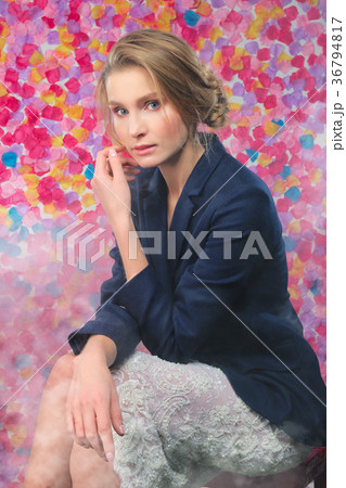 Pretty model in classic jacket and lace skirt  36794817