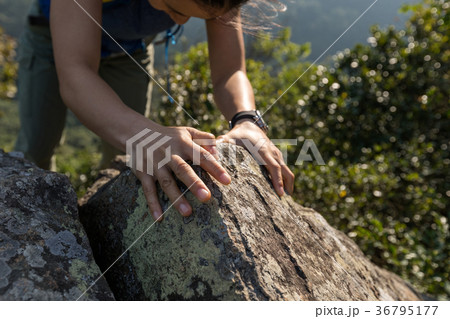 brave woman climbing rock to the mountain top brave woman climbing rock to the mountain top 36795177