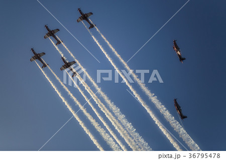 Reactive jet plane flying in formation on blue sky 36795478