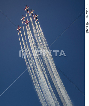 Reactive jet plane flying in formation on blue sky 36795482