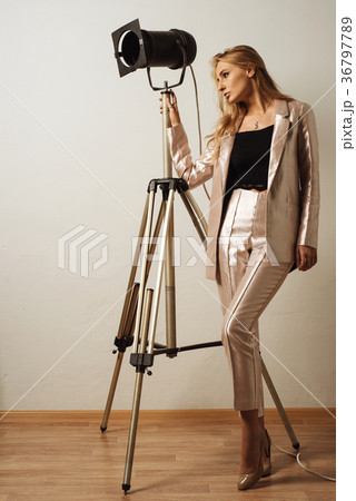 stylish young business woman  stands near lantern 36797789