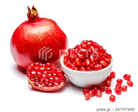Pomegranate and seeds in ceramic bowl close-up 36797940
