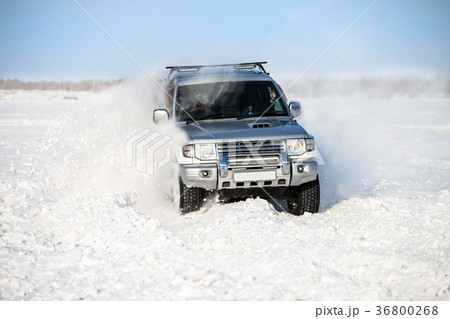 Classic SUV moving in deep snow Classic SUV moving in deep snow 36800268