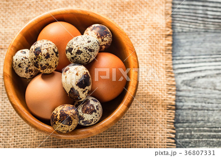 Fresh farm brown eggs on rustic background Fresh farm brown eggs on rustic background 36807331