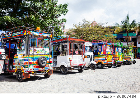 Motor-tricycles decorated as traditional Colombian 36807484