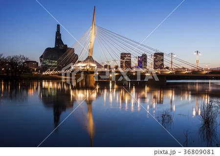 Canada, Manitoba, Winnipeg, Red river reflecting Esplanade Riel Bridge 36809081