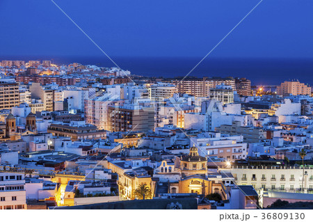 Spain, Andalusia, Almeria, Cityscape with sea at dusk Spain, Andalusia, Almeria, Cityscape with sea at dusk 36809130