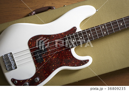 Bass guitar lying on guitar case 36809235