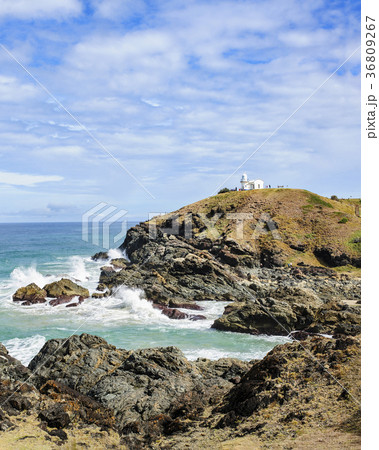 Australia, New South Wales, Cliff and lighthouse in background 36809267