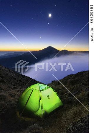 Ukraine, Zakarpattia region, Rakhiv district, Carpathians, Chornohora, Tent on mountain meadow at dusk Ukraine, Zakarpattia region, Rakhiv district, Carpathians, Chornohora, Tent on mountain meadow at dusk 36809361