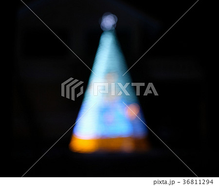 Defocused blue christmas tree on darkness Defocused blue christmas tree on darkness 36811294