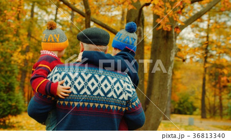 Two little boys and their grandfather in the 36813340