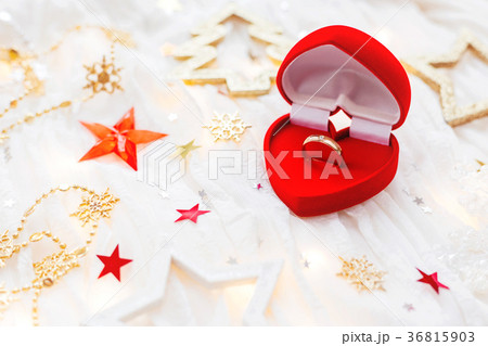 Red gift box with wedding ring and decorations Red gift box with wedding ring and decorations 36815903