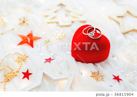 Red gift box with wedding rings and decorations Red gift box with wedding rings and decorations 36815904