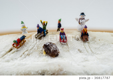 winter concept children sliding down snow mountain 36817787