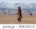 Golden eagle flying towards its trainer 36819515