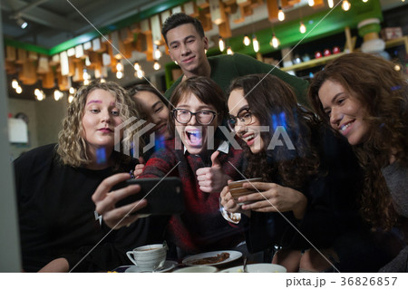 Group of positive teenagers make selfies and 36826857