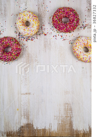 Multicolored donuts close-up 36827332