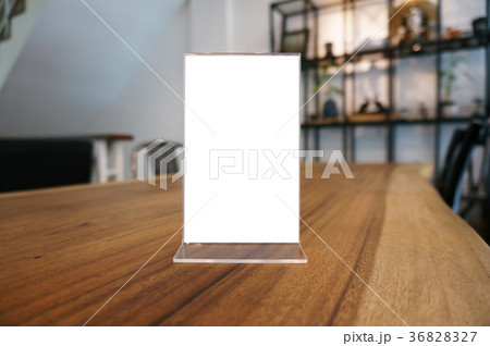 Mock up Menu frame standing on wood table Mock up Menu frame standing on wood table 36828327