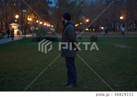 young man walking in the evening park 36829152