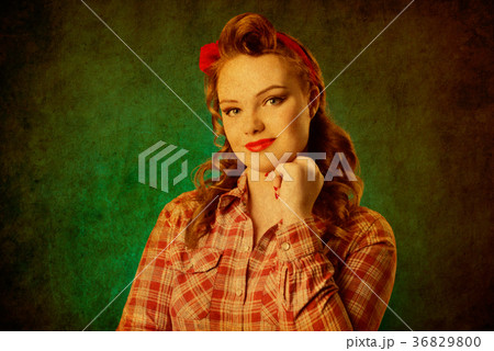 Pretty pinup girl in retro vintage 50's style Pretty pinup girl in retro vintage 50's style 36829800
