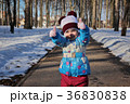 Little girl in winter sunny day 36830838