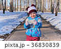 Little girl in winter sunny day 36830839