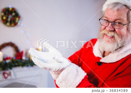 Santa standing with his hands cupped 36834589