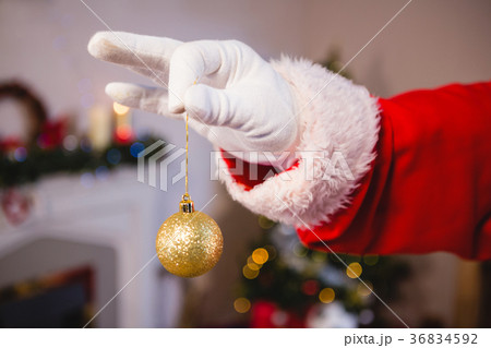 Santa claus holding a bauble 36834592