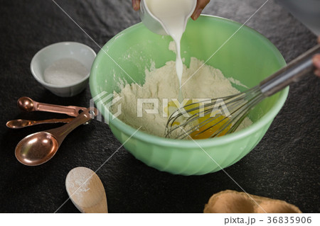 Woman whisking flour in bowl Woman whisking flour in bowl 36835906