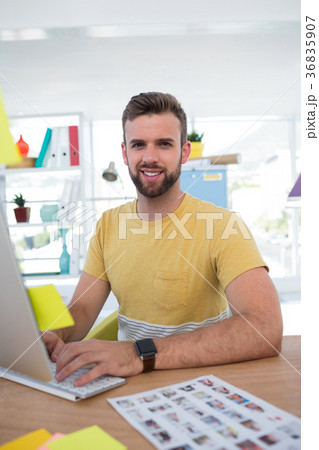 Male executive working on computer Male executive working on computer 36835907