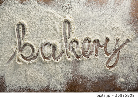 The word bakery written on sprinkled flour The word bakery written on sprinkled flour 36835908