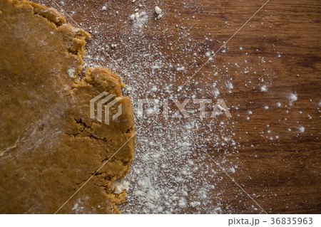 Flattened dough on a wooden table Flattened dough on a wooden table 36835963
