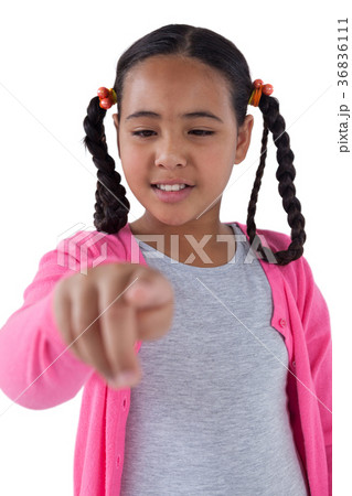 Girl pretending to touch an invisible screen Girl pretending to touch an invisible screen 36836111