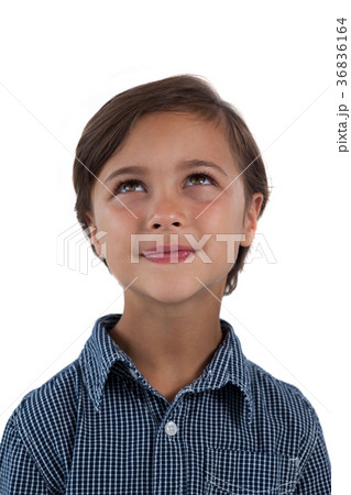 Boy standing against white background Boy standing against white background 36836164