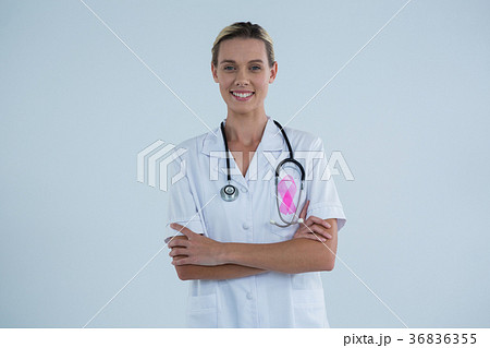 Portrait of female doctor with Breast Cancer Awareness ribbon 36836355
