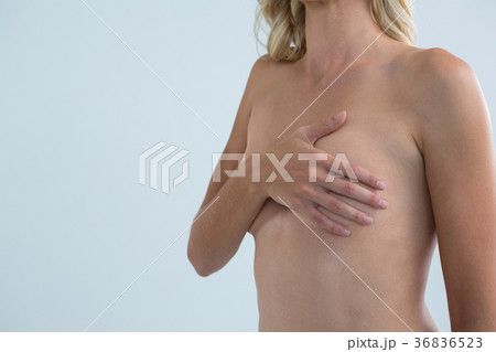 Shirtless woman with hand on chest 36836523