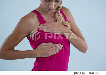 Woman touching breast for lumps Woman touching breast for lumps 36836558