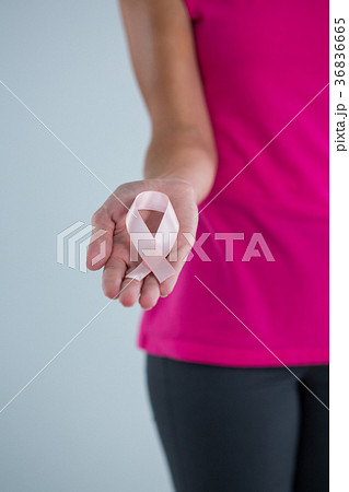 Mid section of female holding pink ribbon Mid section of female holding pink ribbon 36836665