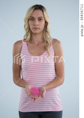 Portrait of young female with pink ribbon Portrait of young female with pink ribbon 36836711