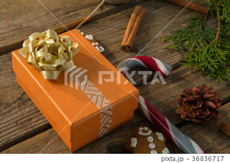 Close up of gift box by candy cane and spice 36836717