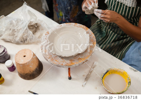 Mid section of woman learning pottery Mid section of woman learning pottery 36836718