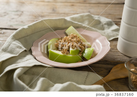 Plate of breakfast cereals with fruits on wooden table Plate of breakfast cereals with fruits on wooden table 36837160