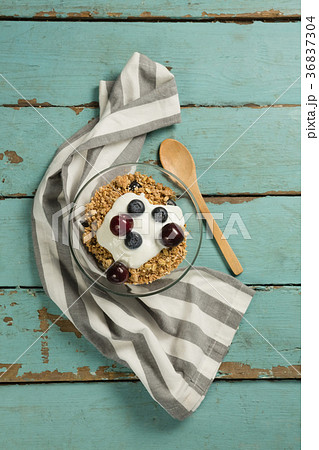 Bowls of breakfast cereals and fruits with yogurt 36837304