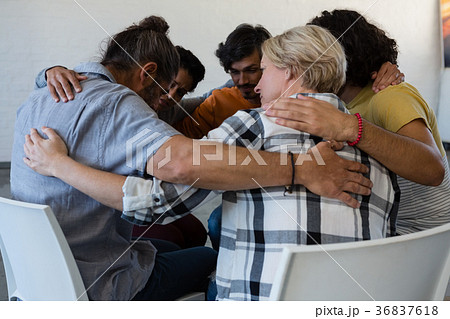 Friends huddling in art class 36837618