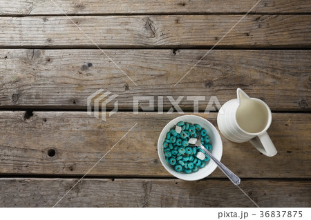 Cereal rings and marshmallow in bowl with milk Cereal rings and marshmallow in bowl with milk 36837875